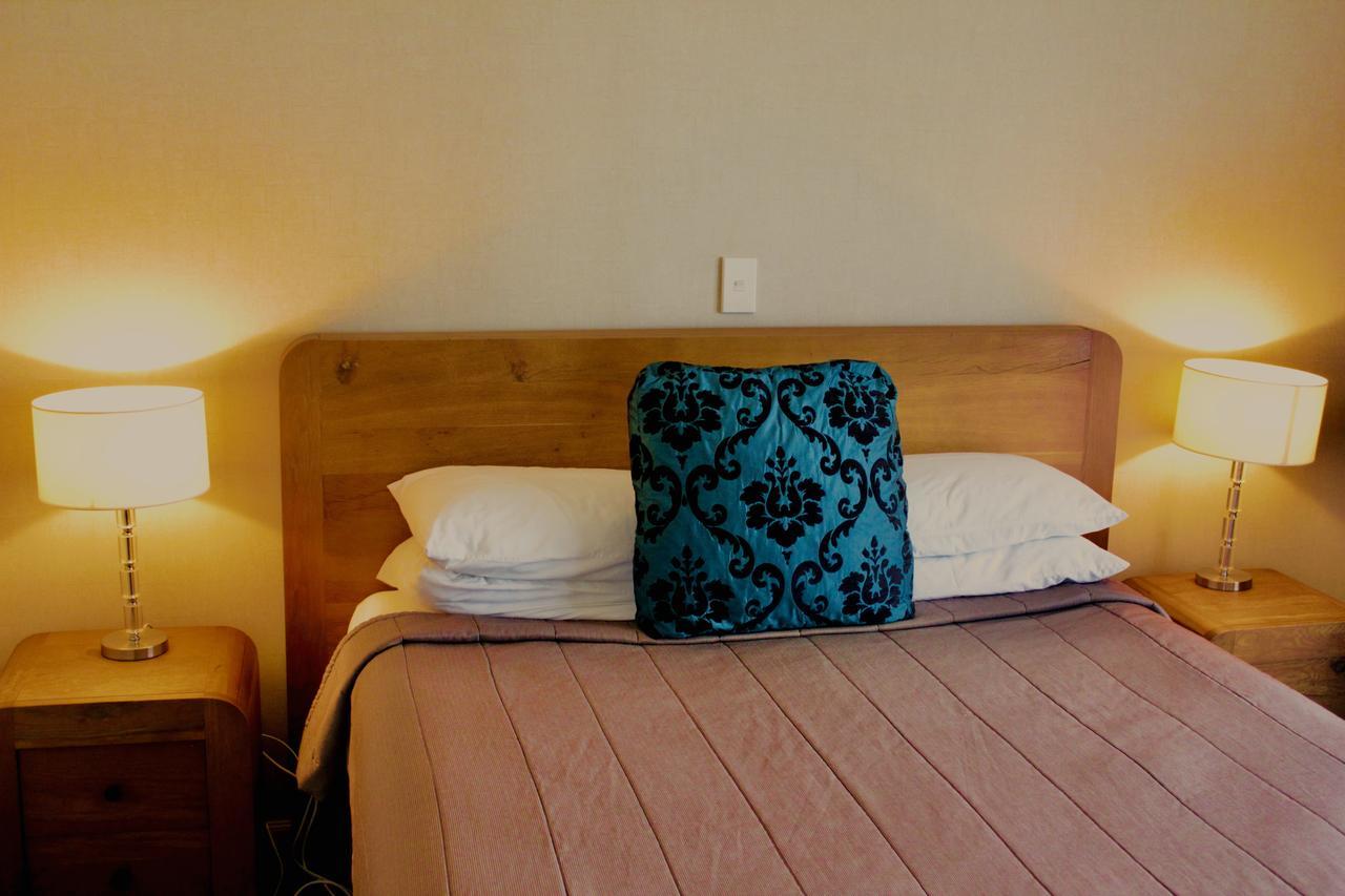 Hotel The Nautilus Napier Exterior foto A bed with a pillow